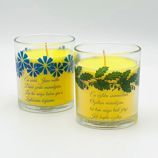 A set of lit candles "for St. John's mother and St. John's father" 2 candles, in glass containers