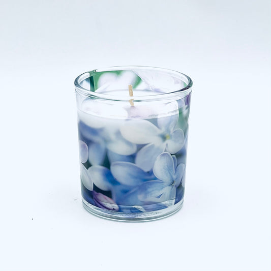 Lilac scented candle in a glass container