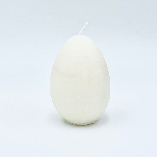 Design candle Easter egg from soy wax, white